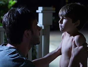 Josh Hamilton and Kadan Rockett star in a scene from the movie "Dark Skies." The Catholic News Service classification is A-III - adults. The Motion Picture Association of America rating is PG-13 - parents strongly cautioned. Some material may be inappropriate for children under 13. (CNS photo/Dimension)