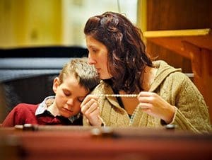 Melisa Sarnowski and her brother Joseph Sarnowski, members of St. Roman Parish, Milwaukee, participate in the Rosary Evangelization Apostolate’s 10th anniversary celebration on Tuesday, Feb. 19 at Saint Francis Seminary, St. Francis. (Catholic Herald photo by Juan C. Medina)