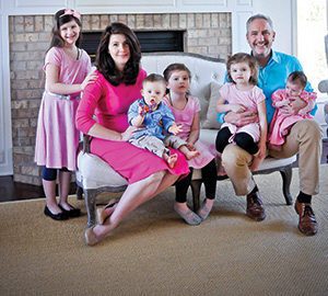 The Cascio family poses for a photo in their Menomonee Falls home on Monday, May 2. Pictured with Michelle and Tim Cascio are their children, Capri, 7, left to right, Culen, 1, Chloe, 5, Clare, 3, and 6-week-old Ciara.