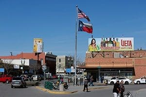 U.S. and Texas flags wave above the roads leading to and from the border with Mexico at the Paso del Norte port of entry in El Paso. (CNS photo/Nancy Wiechec)