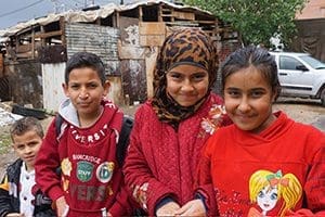 Syrian refugee children stand outside their school in Zahle, Lebanon, in the country's Bekaa Valley April 12. The international Catholic charity Caritas has been instrumental in helping Syrian refugees attend Lebanese public schools to continue their education. (CNS photo/Dale Gavlak)