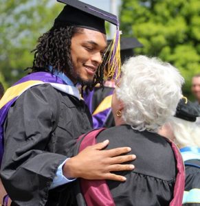 Christian Johnson embraces professor Peggy Tillman after St. Catharine College's graduation ceremony May 14 in Springfield, Ky. Citing insurmountable challenges, including a decline in enrollment and high debt, St. Catharine College trustee John Turner announced June 1 that the school will close in late July. (CNS photo/courtesy St. Catharine College)