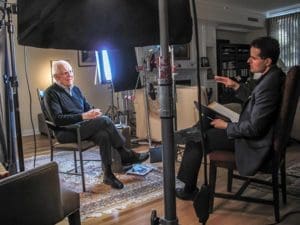 Director David Naglieri interviews former U.S. President Ronald Reagan's national security adviser, Richard Allen, in his Denver home as part of the documentary "Liberating a Continent: John Paul II and the Fall of Communism." The documentary will be broadcast on PBS stations throughout the month of June. (CNS photo/George Hosek, Liberating a Continent)