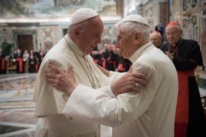 Pope Francis greets retired Pope Benedict XVI during a June 28 ceremony at the Vatican marking the 65th anniversary of the retired pope's priestly ordination. (CNS photo/L'Osservatore Romano, handout)