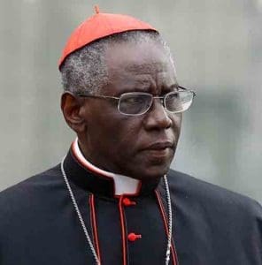 Cardinal Robert Sarah, prefect of the Congregation for Divine Worship and the Sacraments, is pictured at the Vatican in this Oct. 9, 2012, file photo. Cardinal Sarah, the Vatican’s liturgy chief, has asked priests to begin celebrating the Eucharist facing east, the same direction the congregation faces. Although not commonplace, the practice is already permitted by church law. Cardinal Sarah made his request during a speech at the Sacra Liturgia conference in London July 5. (CNS photo/Paul Haring) 