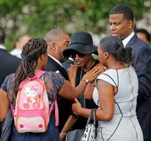 Family members comfort Diamond Reynolds, the girlfriend of Philando Castile, as his casket arrives July 14 for a funeral service at the Cathedral of St. Paul in St. Paul, Minn. Church officials said the mother of 32-year-old man, who was not Catholic, requested the cathedral hold an ecumenical service for her son. Castile was shot and killed by a police officer July 6. (CNS photo/Eric Miller, Reuters)