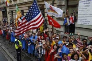 The U.S. flag is seen among cheering pilgrims as Pope Francis arrives on a tram for the World Youth Day welcoming ceremony in Blonia Park in Krakow, Poland, July 28. (CNS photo/Paul Haring) See POPE-POLAND-WYD-WELCOME July 28, 2016.