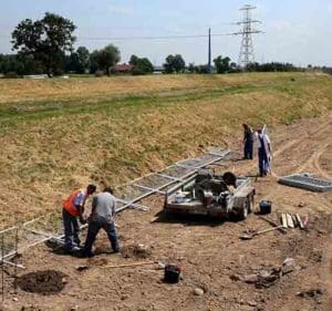 Workers install security barriers at the site of Campus Misericordiae in Brzegi, Poland June 15. (CNS photo/Grzegorz Momot, EPA)