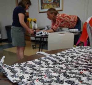 In the Women’s Craft Circle, women learn to crochet yarn spun from recycled plastic bags – “plarn” – into waterproof picnic mats. Their hope is to transition those skills into a worker-owned cooperative. (Catholic Herald photo by Ricardo Torres)