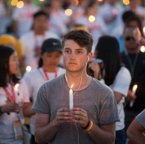 World Youth Day pilgrims hold candles during eucharistic adoration with Pope Francis at the July 30 prayer vigil at the Field of Mercy in Krakow, Poland. (CNS photo/Jaclyn Lippelmann, Catholic Standard)