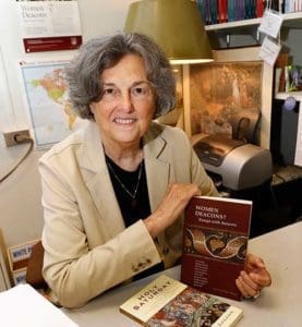 Phyllis Zagano, a senior research associate in the religion department at Hofstra University in Hempstead, N.Y., is seen in her office Aug. 2. Zagano, who has written extensively on the subject of women deacons, is one of six women appointed by Pope Francis to a 13-person “Commission to Study the Women’s Diaconate.” (CNS photo/Gregory A. Shemitz)