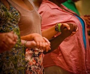 Congregants hold hands and pray the Our Father during the Aug. 18 Mass for Peace held at All Saints Church, Milwaukee. The Mass was held five days after riots broke out in an area of the city following the killing by a Milwaukee police officer of an armed 23-year-old man after a traffic stop. (Catholic Herald photo by Juan C. Medina)