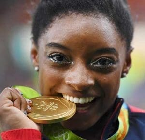 U.S. gymnast Simone Biles celebrates winning gold in the women's individual all-around final during the Olympics in Rio de Janeiro Aug. 11. (CNS photo/Dylan Martinez, Reuters) 
