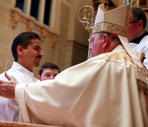 Deacon Henry Reyes is ordained a deacon for the Archdiocese of Milwaukee by Archbishop Jerome E. Listecki on Saturday, Sept. 10, at the Cathedral of St. John the Evangelist, Milwaukee. He has been appointed to serve at St. Anthony and St. Hyacinth parishes, Milwaukee. (Catholic Herald Family photo by Allen Fredrickson)