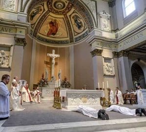 Frs. Daniel Steiner and Rodolfo Rivera lie prostrate before the altar of the Cathedral of the Incarnation during the Litany of Supplication in Nashville, Tenn., June 3 during their ordination Mass. Attempting suicide is an obstacle to ordination as a Catholic priest, said a new Vatican ruling (CNS photo/Rick Musacchio, Tennessee Register)