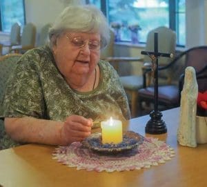 Agnes Imdieke of Albany, Minn., pictured Sept. 6, has been lighting a candle for Jacob Wetterling every morning since he disappeared in October 1989. A Minnesota man confessed to kidnapping and killing the boy during a hearing Sept. 6. (CNS photo/Dianne Towalski, The Visitor) 