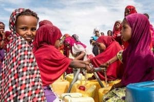 In Kindjani, Niger, people collect water that was delivered to the community by Catholic Relief Services. (CNS photo/Michael Stulman, CRS) 