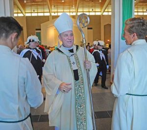 Archbishop Jerome E. Listecki prepares to process into St. John XXIII Church, Sept. 11, to celebrate an inaugural Mass at the newly merged parish. (Catholic Herald photo by Sam Arendt)