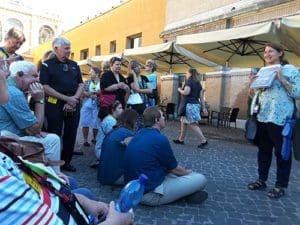 Pilgrims from St. Teresa of Calcutta Parish, North Lake, listen to a tour guide before entering the Sistene Chapel in Rome. (Submitted photo courtesy St. Teresa of Calcutta Parish)
