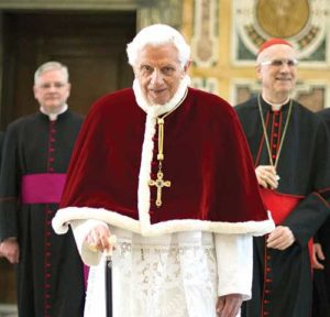 Pope Benedict XVI walks with his cane in 2013 at the Vatican following his final general audience. Retirement has given the 89-year-old Pope Benedict what he describes as the gift of silence to enter more deeply into prayer, especially with the Psalms and the writings of early church theologians. (CNS photo/L’Osservatore Romano)