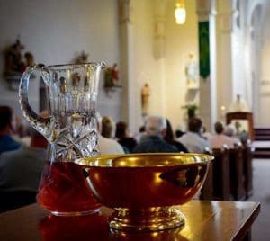 The offertory gifts await presentation during Mass, May 28, at St. Catherine of Alexandria Parish, Milwaukee. Susan McNeil, director of the Nazareth Project for Marriage and Family Life, likened the celebration of weekend Masses to the front porch of the church, “the most important thing we do.” (Catholic Herald photo by Juan C. Medina)