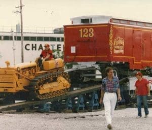 Chris Peterson, the second eldest son of Deacon Jim Peterson and his wife Donna, drives a Caterpillar tractor to unload a circus train car in an undated photo. Donna and Deacon Jim Peterson, a deacon at St. Sebastian Parish, Milwaukee, pictured in an undated photo, credit their volunteer experience with the circus parade as one reason their family has remained so close. (Submitted photos courtesy the Peterson family)