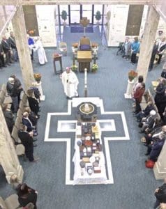 Archbishop Jerome E. Listecki reads the final commendation from the Ritual Order of Christian Funerals during the All Souls Remembrance Mass, Nov. 2, at Holy Cross Cemetery, Milwaukee. (Catholic Herald photo by Patrick Dean)