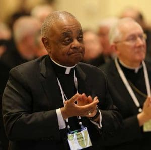 Atlanta Archbishop Wilton D. Gregory, center, and other prelates applaud Nov. 14 after an address by Archbishop Christophe Pierre, apostolic nuncio to the United States, during the annual fall general assembly of the U.S. Conference of Catholic Bishops in Baltimore. (CNS photo/Bob Roller)
