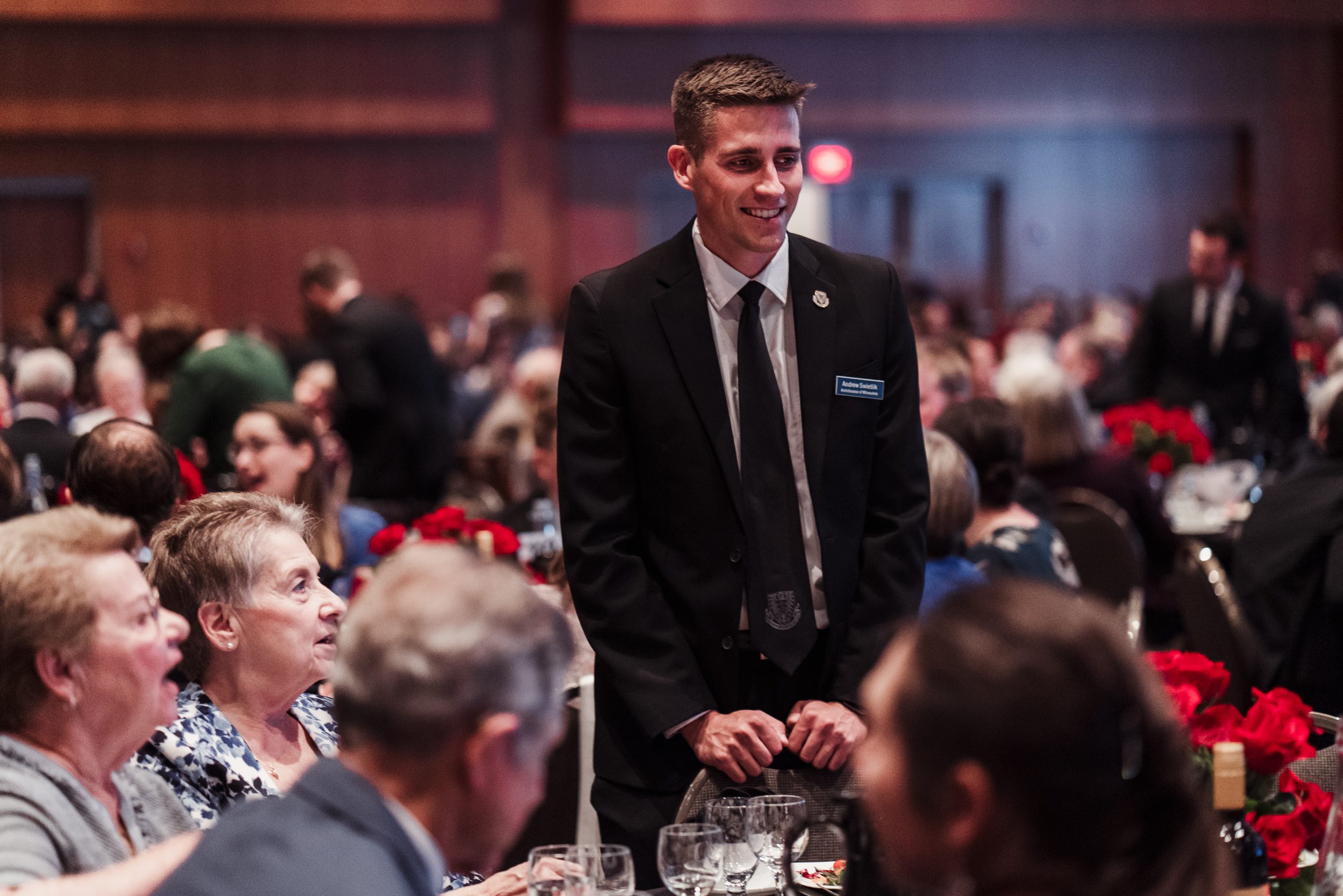 Seminarian speaks with attendees