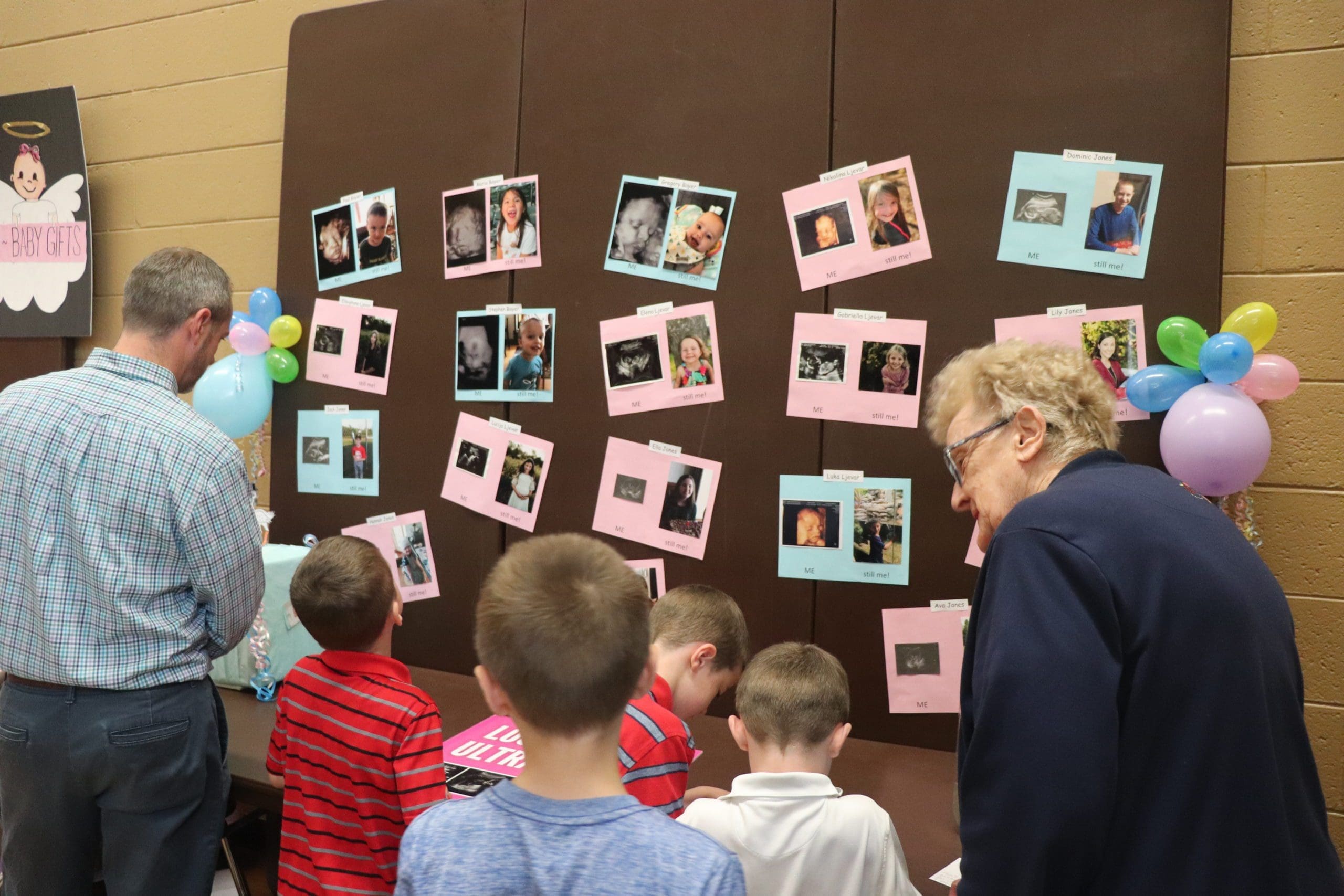 Photo 2 – Sacred Herat Parish – Celebration of Life – Me-Still Me display with ultrasound and current photos of children