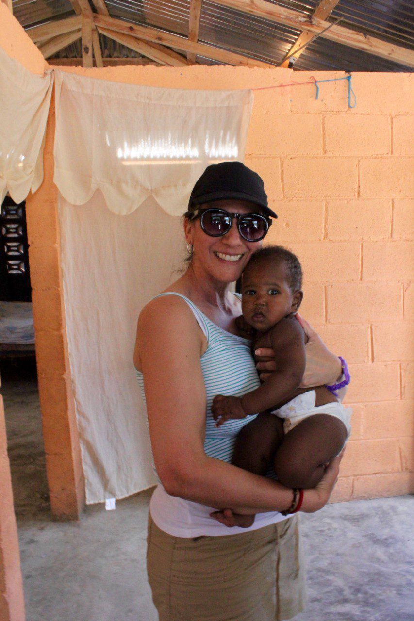 idalia nieves-reyes photo with child, 2017 mission trip to LSF