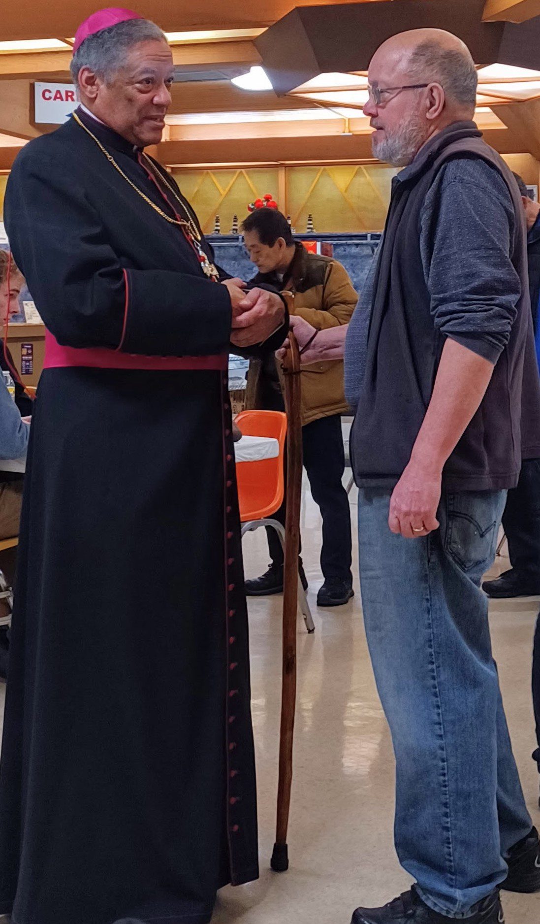 Bishop Perry at reception following mission